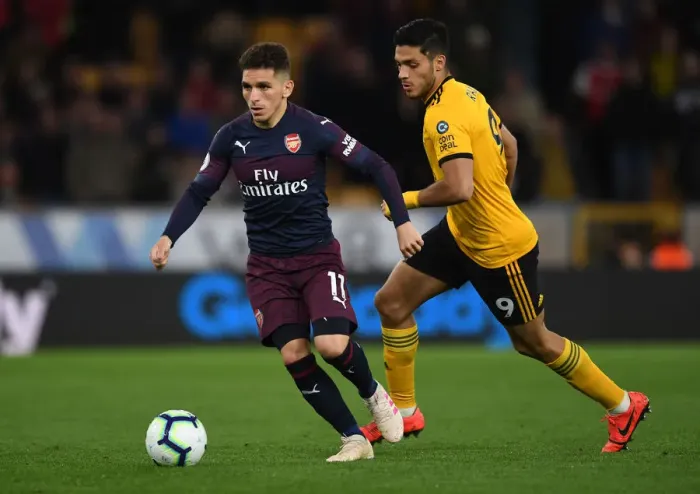 Framed Print : Torreira vs. Jimenez: Intense Battle in Wolverhampton Wanderers vs. Arsenal FC Premier League Clash