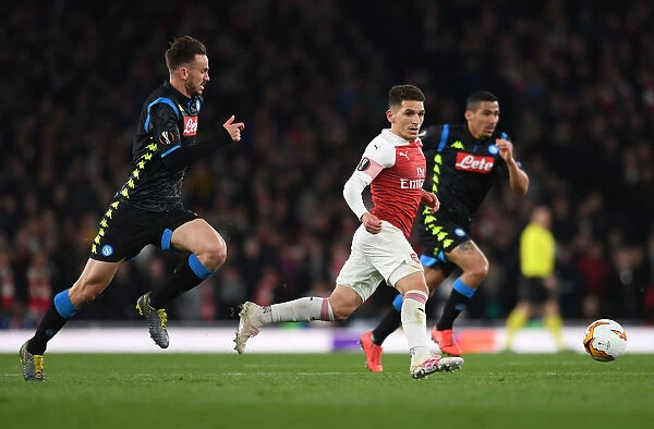 Torreira vs. Ruiz: A Midfield Battle in Arsenal's Europa League Clash against Napoli