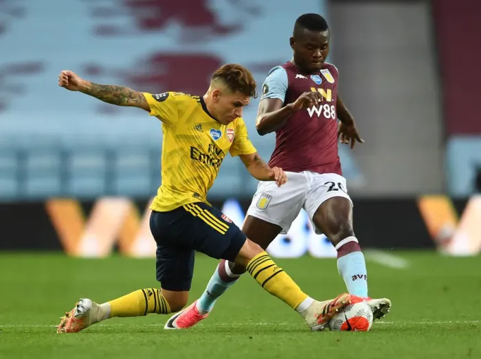 Framed Print : Torreira vs. Samatta: Intense Clash in Aston Villa vs. Arsenal Premier League Showdown