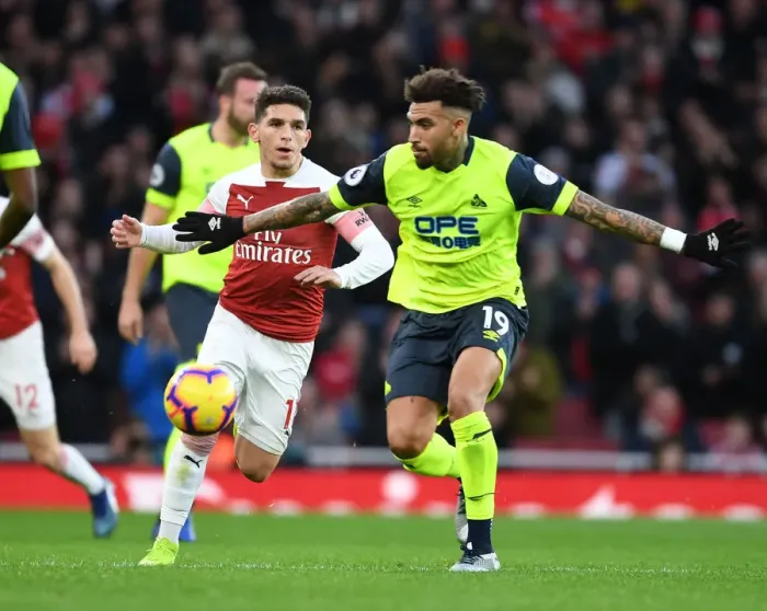Framed Print : Torreira vs. Williams: Intense Battle at Emirates Stadium - Arsenal vs. Huddersfield, Premier League