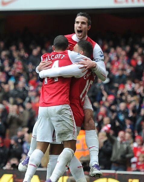 Triumphant Arsenal Threesome: Oxlade-Chamberlain, Walcott, and van Persie Celebrate Goals Against Blackburn Rovers (2011-12)