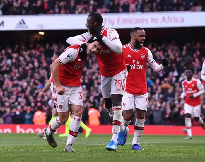 Framed Print : Triumphant Arsenal Trio: Martinelli, Lacazette, and Pepe Celebrate Goal Against Sheffield United (2019-20)