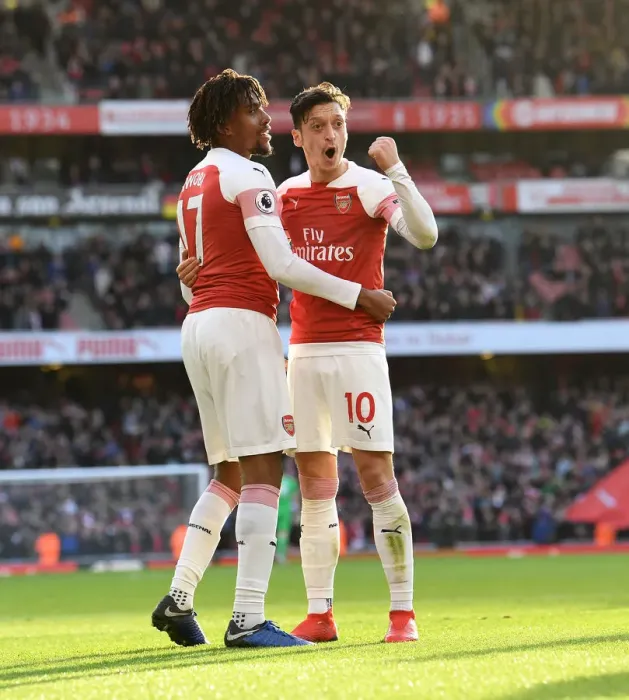 Framed Print : Triumphant Moment: Iwobi and Ozil's Unforgettable Goal Celebration (Arsenal vs Burnley, 2018-19)