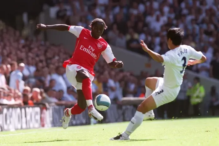 Framed Print : Triumphant Rivals: Sagna's Double Strike Against Lee Young-Pyo and Tottenham
