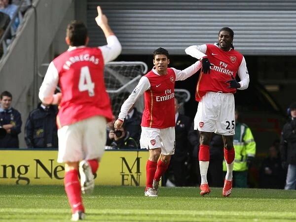 Triumphant Threesome: Adebayor, Eduardo, and Fabregas Celebrate Arsenal's First Goal in Manchester City R rout (2008)