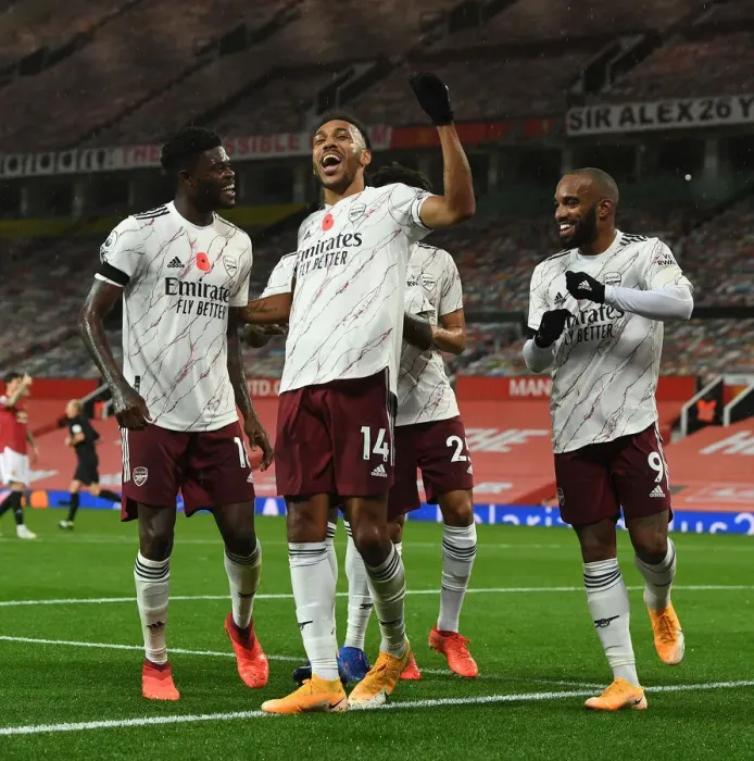 Framed Print : Triumphant Threesome: Aubameyang, Partey, Lacazette's Empty Old Trafford Goal Celebration (Manchester United vs Arsenal, 2020-21) Framed Print : Triumphant Threesome: Aubameyang, Partey, Lacazette's Empty Old Trafford Goal Celebration (Manchester United vs Arsenal, 2020-21)