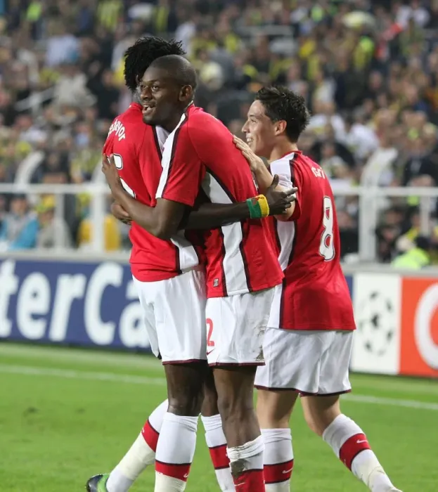 Framed Print : Triumphant Threesome: Diaby, Adebayor, Nasri Celebrate Arsenal's 3rd Goal in 2:5 Victory over Fenerbahce (UEFA Champions League, Group G)