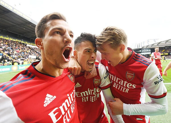 Triumphant Threesome: Martinelli, Odegaard, and Cedric's Euphoric Moment after Arsenal's Victory over Watford (March 2022)