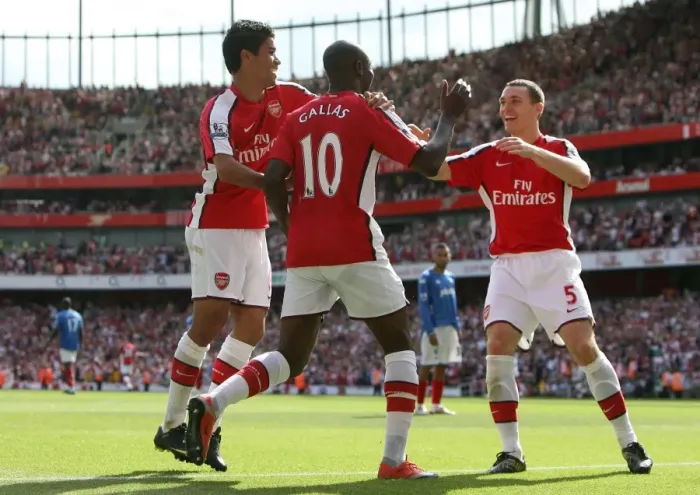 Framed Print : Triumphant Threesome: William Gallas, Eduardo, and Thomas Vermaelen Celebrate Arsenal's 4-1 Victory Over Portsmouth