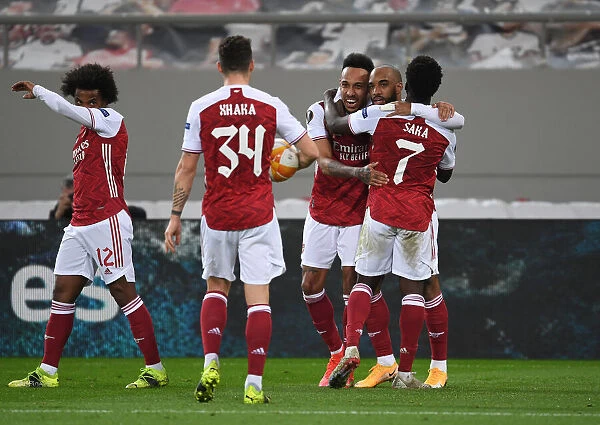 Triumphant Trio: Aubameyang, Lacazette, and Saka's Goal Celebration in Arsenal's Europa League Victory over SL Benfica