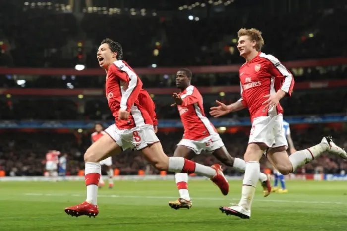 Framed Print : Triumphant Triple: Nasri, Bendtner, and Eboue Celebrate Arsenal's 5-0 Victory over FC Porto