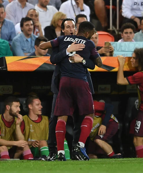Unai Emery and Alexandre Lacazette Celebrate Arsenal's Europa League Semi-Final Goal Against Valencia