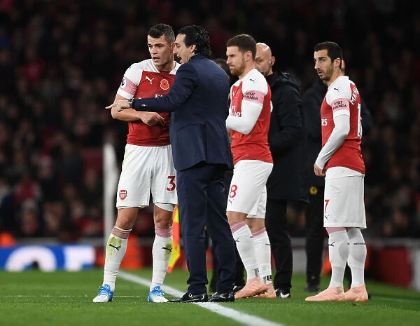 Unai Emery Coaches Granit Xhaka during Arsenal's Clash against Wolverhampton Wanderers