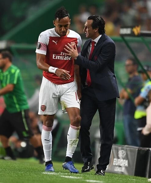 Unai Emery Consults with Aubameyang during Arsenal's Europa League Match