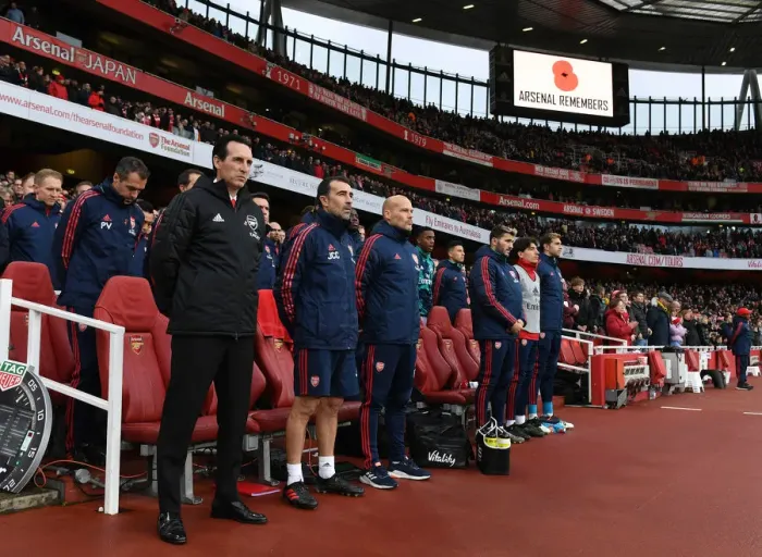 Framed Print : Unai Emery Honors the Fallen: A Moment of Silence at Arsenal's Emirates Stadium (2019-20)