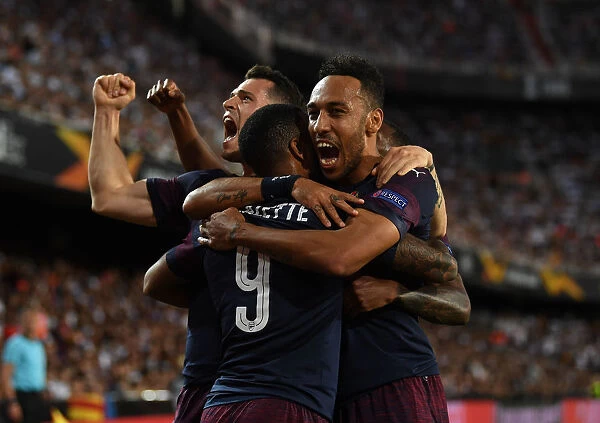United in Victory: Aubameyang, Lacazette, and Xhaka's Triumphant Goal Celebration in Arsenal's Europa League Semi-Final Win over Valencia