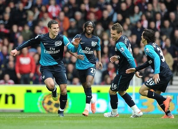 United in Victory: Van Persie, Gervinho, Ramsey, and Benayoun Celebrate Goal Against Stoke City