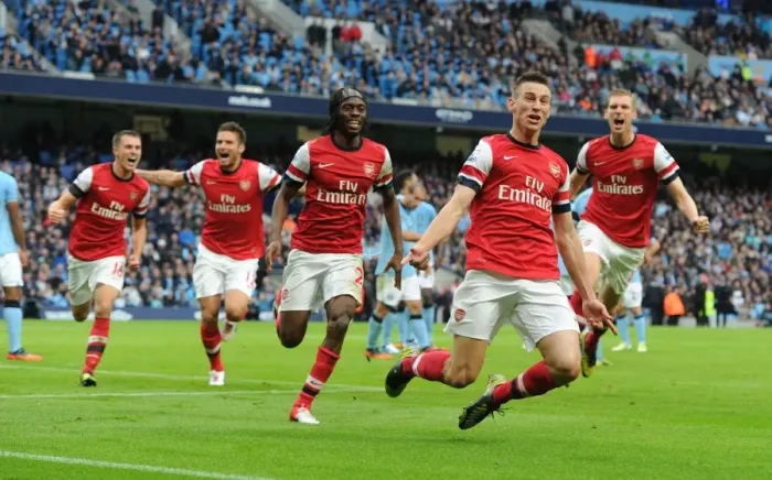 Framed Print : Unstoppable Foursome: Arsenal's Epic Goal Celebration - Koscielny, Giroud, Ramsey, and Mertesacker vs. Manchester City (2012-13)