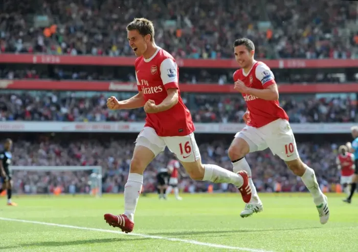 Framed Print : Unstoppable Partnership: Ramsey and van Persie's 1-0 Victory Over Manchester United
