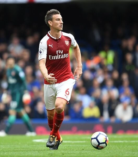 Unwavering Focus: Laurent Koscielny's Intense Concentration in the Chelsea-Arsenal Rivalry (2017-18)