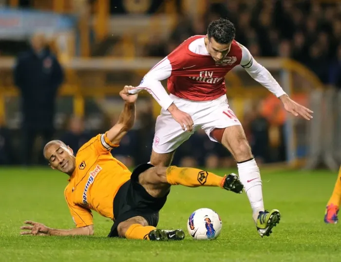 Framed Print : Van Persie vs. Henry: Intense Clash in Arsenal's Win Against Wolverhampton Wanderers (2012) Framed Print : Van Persie vs. Henry: Intense Clash in Arsenal's Win Against Wolverhampton Wanderers (2012)