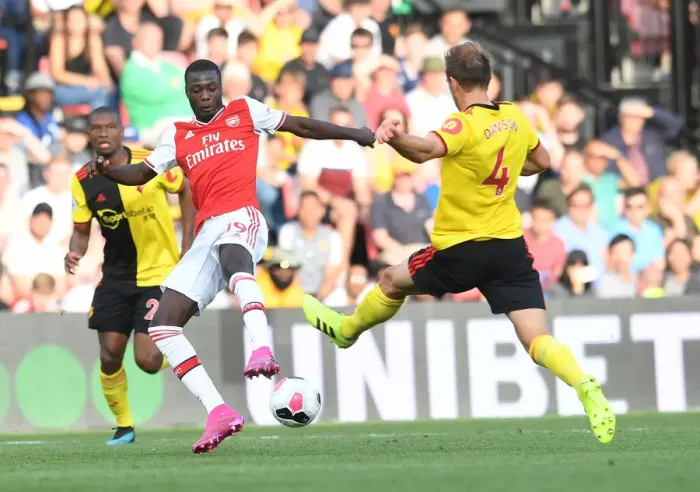 Framed Print : Watford vs Arsenal: Pepe vs Dawson Clash in Premier League Showdown Framed Print : Watford vs Arsenal: Pepe vs Dawson Clash in Premier League Showdown