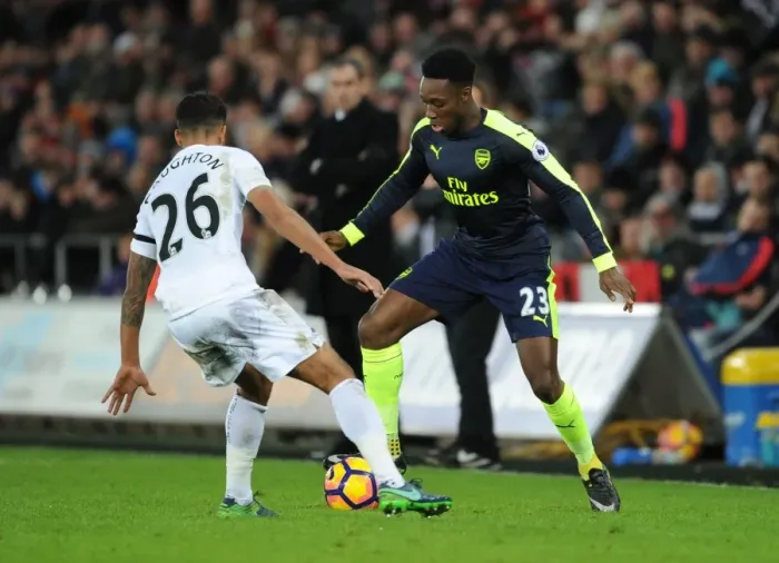 Framed Print : Welbeck vs Naughton: Intense Battle in Swansea City vs Arsenal Premier League Clash