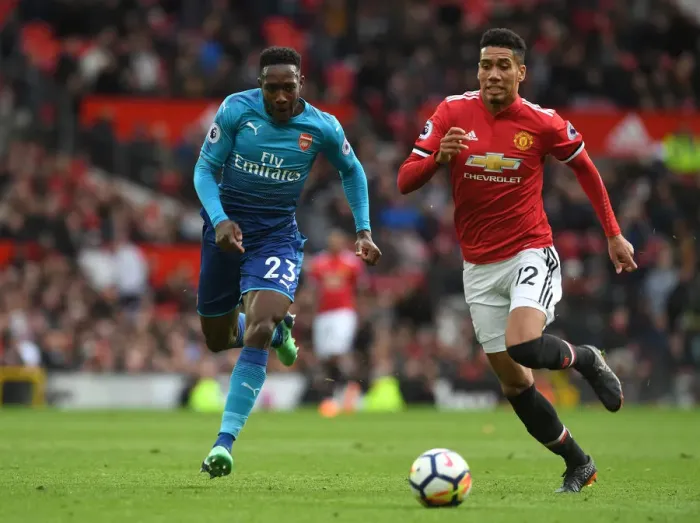 Framed Print : Welbeck vs Smalling: A Premier League Battle - Arsenal's Danny Welbeck Clashes with Manchester United's Chris Smalling Framed Print : Welbeck vs Smalling: A Premier League Battle - Arsenal's Danny Welbeck Clashes with Manchester United's Chris Smalling