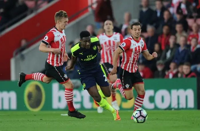 Framed Print : Welbeck vs Ward-Prowse: Intense Battle in Southampton v Arsenal Premier League Clash Framed Print : Welbeck vs Ward-Prowse: Intense Battle in Southampton v Arsenal Premier League Clash