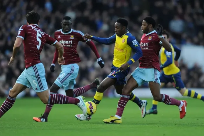 Framed Print : Welbeck vs. West Ham: Intense Battle at the Boleyn Ground (Arsenal vs. West Ham, Premier League 2014-15)