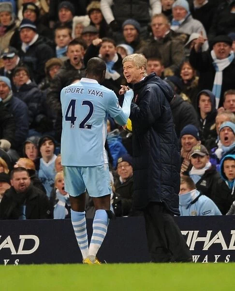 Wenger and Toure: A Light-Hearted Moment Amidst the Manchester Rivalry (2011-12)