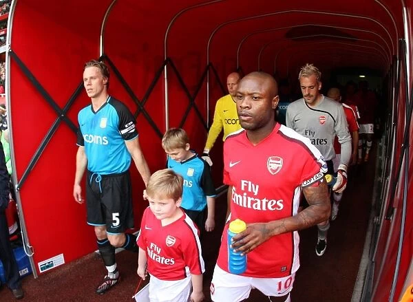 William Gallas (Arsenal) lead the team out of the tunnel alongside Martin Laursen (Villa)