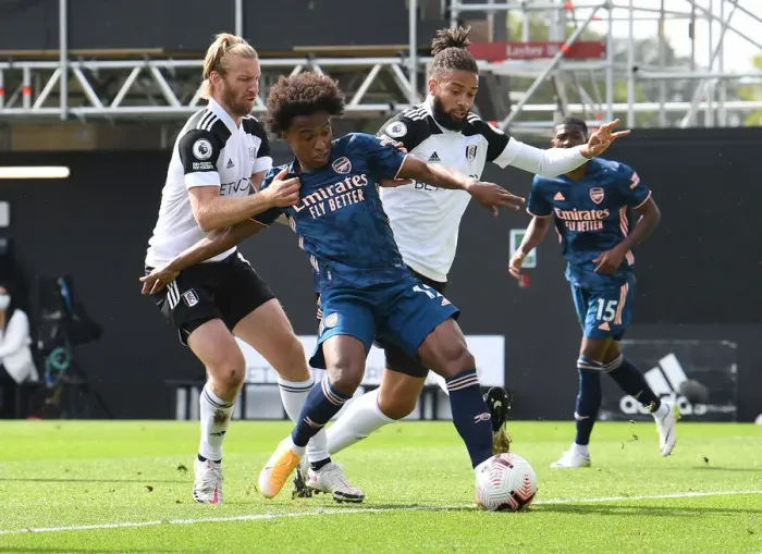 Framed Print : Willian Faces Off Against Fulham Defenders Ream and Hector in Arsenal's Premier League Clash Framed Print : Willian Faces Off Against Fulham Defenders Ream and Hector in Arsenal's Premier League Clash