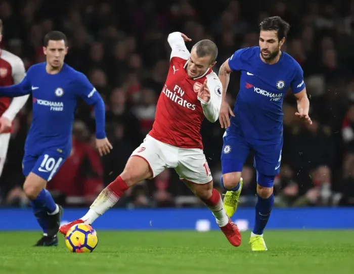 Framed Print : Wilshere Outsmarts Fabregas: Epic Battle Between Former Arsenal Teammates in Premier League Clash
