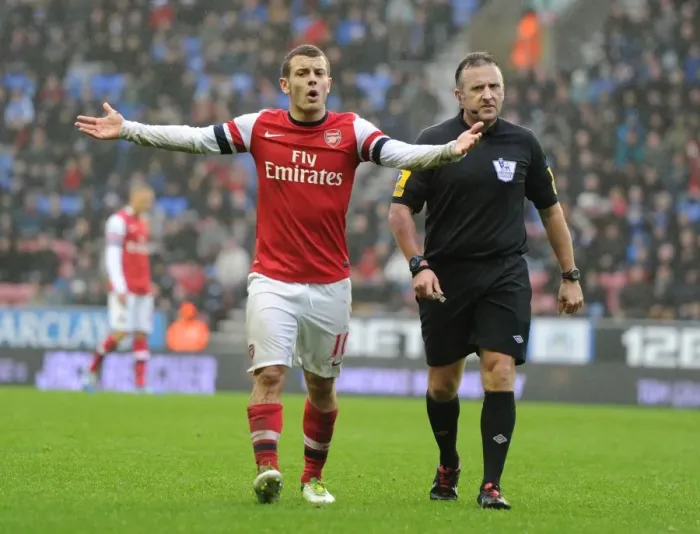 Framed Print : Wilshere and Referee Clash: Wigan Athletic vs. Arsenal, Premier League 2012-13