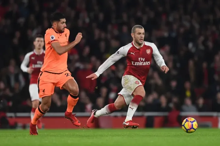 Framed Print : Wilshere vs. Can: A Premier League Rivalry Erupts on the Arsenal Field