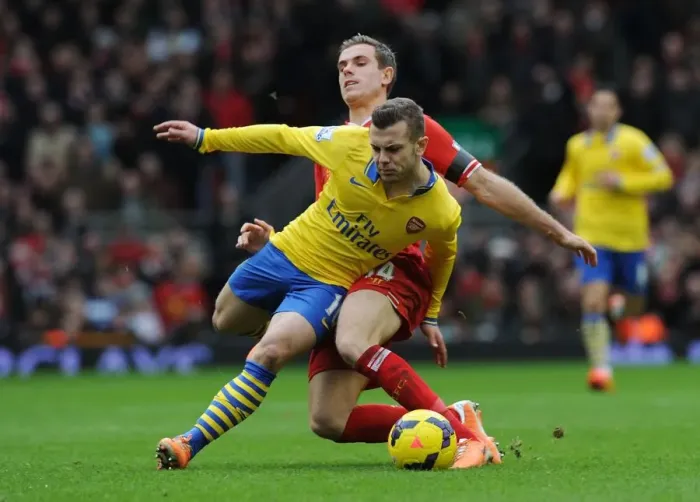 Framed Print : Wilshere vs. Henderson: The Anfield Battle - Premier League 2013-14