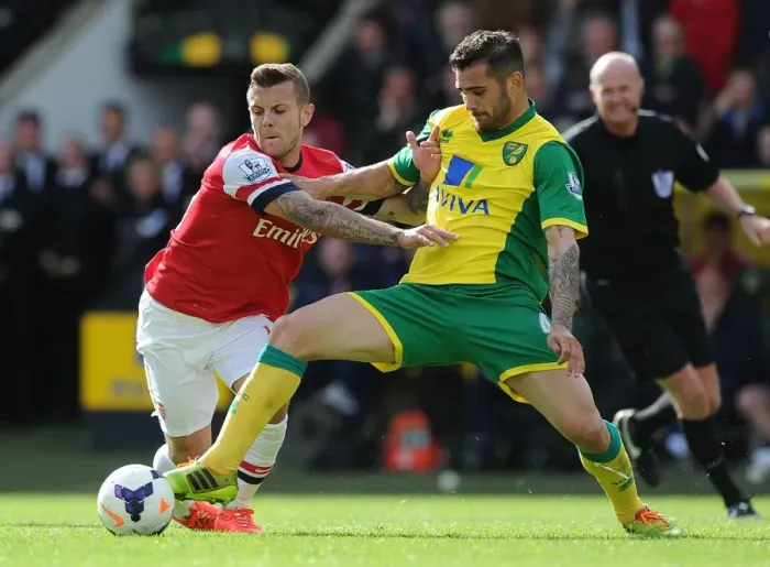 Framed Print : Wilshere vs. Johnson: Intense Battle in Norwich City vs. Arsenal (Premier League 2013-14) Framed Print : Wilshere vs. Johnson: Intense Battle in Norwich City vs. Arsenal (Premier League 2013-14)