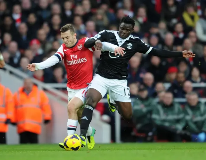 Framed Print : Wilshere vs. Wanyama: Intense Battle in Arsenal v Southampton (2013-14)