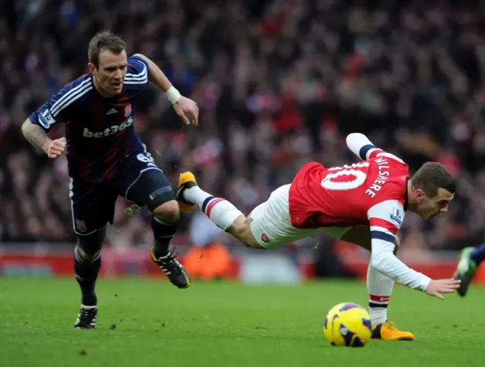 Framed Print : Wilshere vs. Whelan: A Midfield Battle at Arsenal vs. Stoke City, Premier League 2012-13