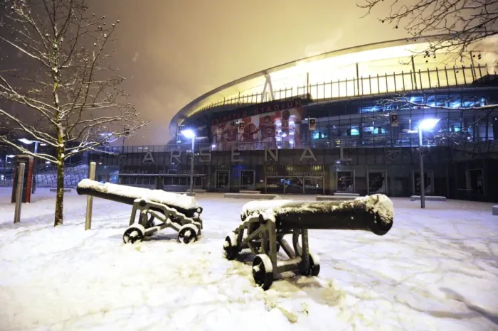Framed Print : Winter's Battle: Arsenal's Emirates Stadium Transformed in Snow vs. Blackburn Rovers