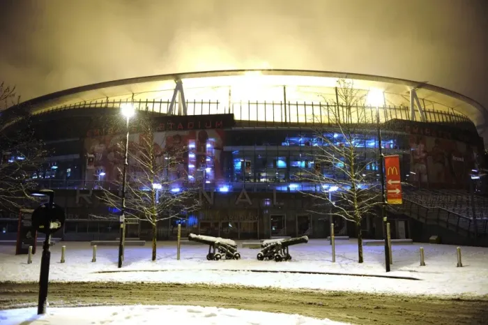 Framed Print : Winter's Battle at Emirates: Arsenal vs. Blackburn Rovers in a Snow-Covered Premier League