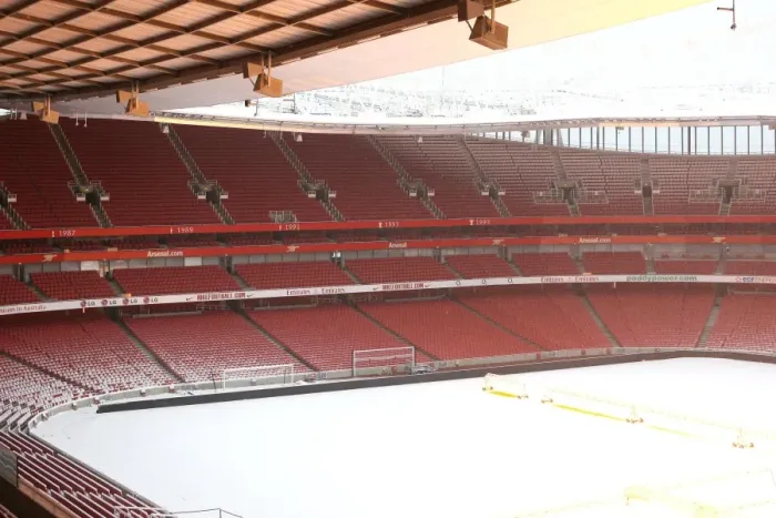 Framed Print : Winter's Embrace at Emirates: Arsenal's Stadium Transformed in Snow