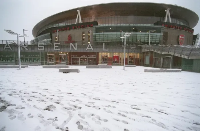 Framed Print : Winter's Embrace at Emirates: A Magical Arsenal Football Ground in Snow