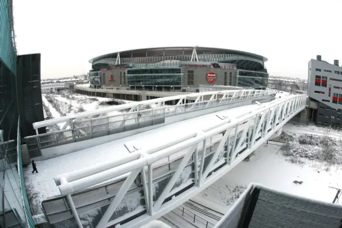 Framed Print : Winter's Embrace at Emirates: A Snowy Transformation of Arsenal Football Club's Stadium