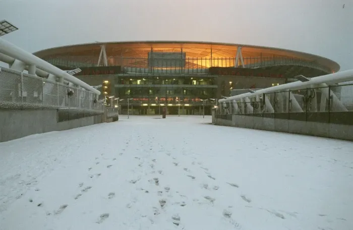 Framed Print : Winter's Enchantment at Emirates: Arsenal's Stadium Blanketed in Snow