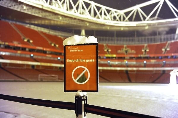 Winter's Grip: Arsenal's Emirates Stadium Blanketed in Snow