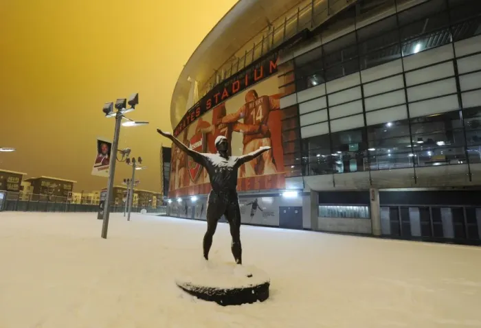 Framed Print : Winter's Grip: Arsenal's Emirates Stadium Blanketed in Snow, Premier League 2012, London