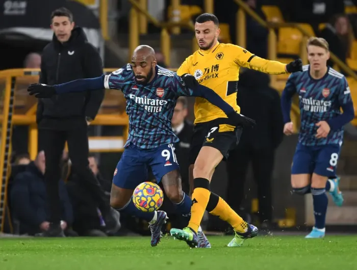 Framed Print : Wolverhampton Wanderers vs. Arsenal: Lacazette Tripped by Saiss in Intense Premier League Clash
