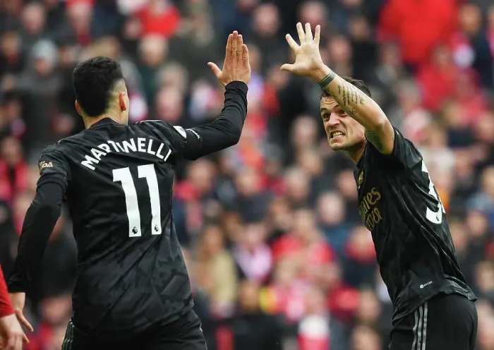 Framed Print : Xhaka and Martinelli Celebrate Arsenal's Victory over Liverpool in the 2022-23 Premier League